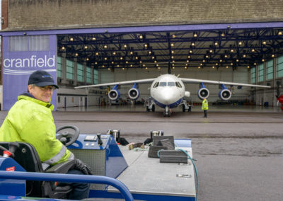 Dean outside the aircraft hangar