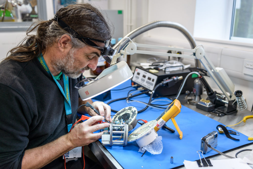 Scientist working with magnifying glass