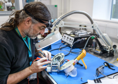 Scientist working with magnifying glass